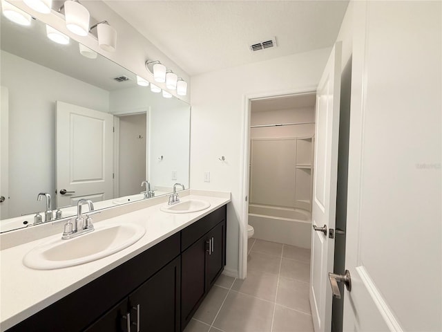 1138 Calico Pointe Cir, Groveland, FL 34736 - full bathroom with double vanity and tile patterned floors