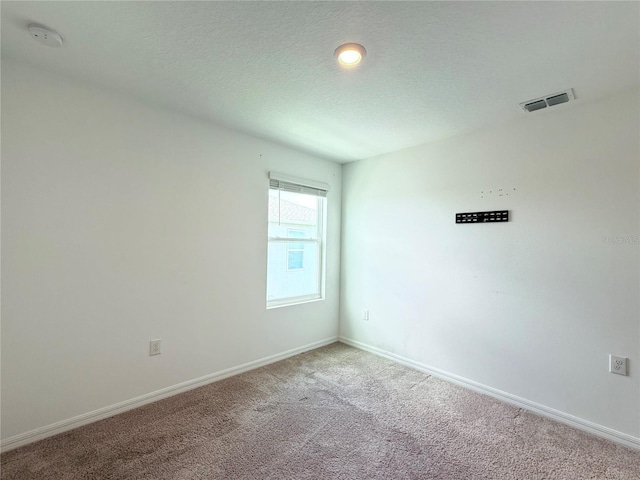1138 Calico Pointe Cir, Groveland, FL 34736 - carpeted empty room featuring a smoke detector and a textured ceiling
