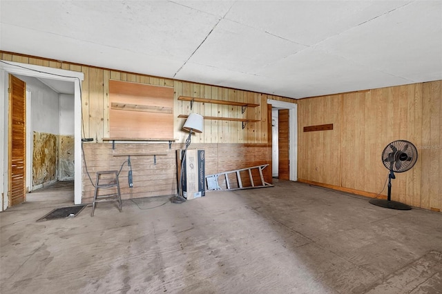 54544 Buckhorn Rd, Astor, FL 32102 - unfurnished living room with wooden walls and concrete flooring