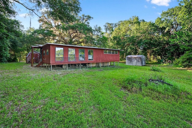54544 Buckhorn Rd, Astor, FL 32102 - back of house featuring a lawn and a shed