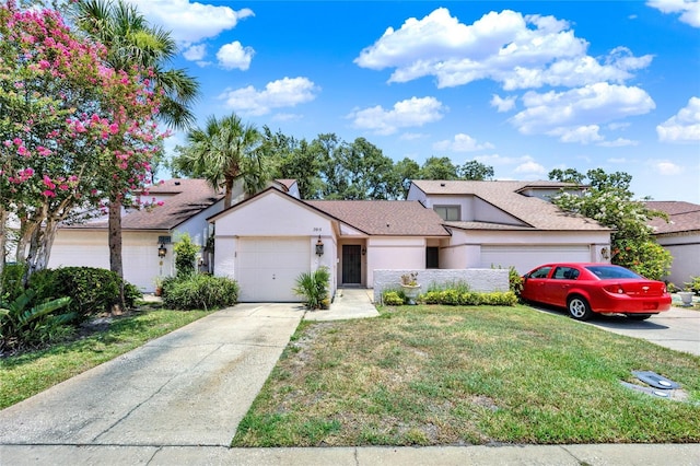 2815 Spyglass Cv, Longwood, FL 32779 - mid-century modern home featuring a garage, driveway, stucco siding, a front yard, and a shingled roof