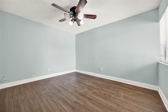 2815 Spyglass Cv, Longwood, FL 32779 - unfurnished room with ceiling fan, dark wood-style floors, a textured ceiling, and healthy amount of natural light