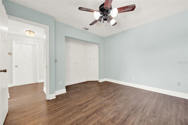 2815 Spyglass Cv, Longwood, FL 32779 - unfurnished bedroom featuring wood finished floors, ceiling fan, and a closet