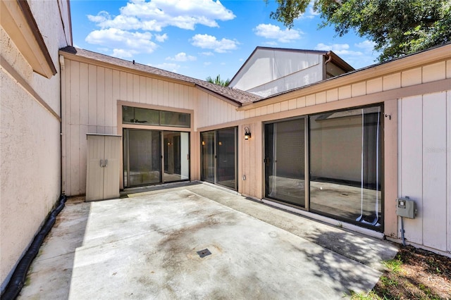 2815 Spyglass Cv, Longwood, FL 32779 - back of property with a patio area and roof with shingles