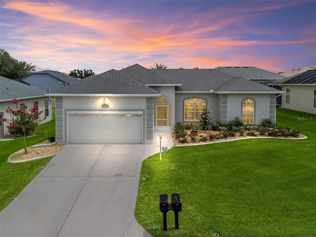 16863 SE 110th Court Rd, Summerfield, FL 34491 - single story home with roof with shingles, an attached garage, concrete driveway, and a yard
