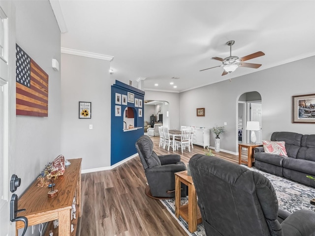 16863 SE 110th Court Rd, Summerfield, FL 34491 - living area featuring arched walkways, ceiling fan, wood finished floors, ornamental molding, and recessed lighting