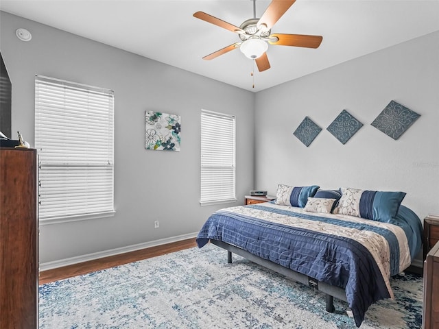 16863 SE 110th Court Rd, Summerfield, FL 34491 - bedroom featuring wood finished floors and a ceiling fan