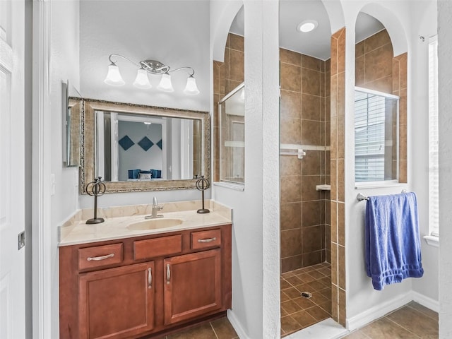 16863 SE 110th Court Rd, Summerfield, FL 34491 - bathroom featuring a tile shower, vanity, and tile patterned flooring