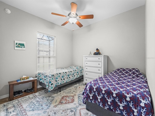 16863 SE 110th Court Rd, Summerfield, FL 34491 - bedroom with a ceiling fan and wood finished floors