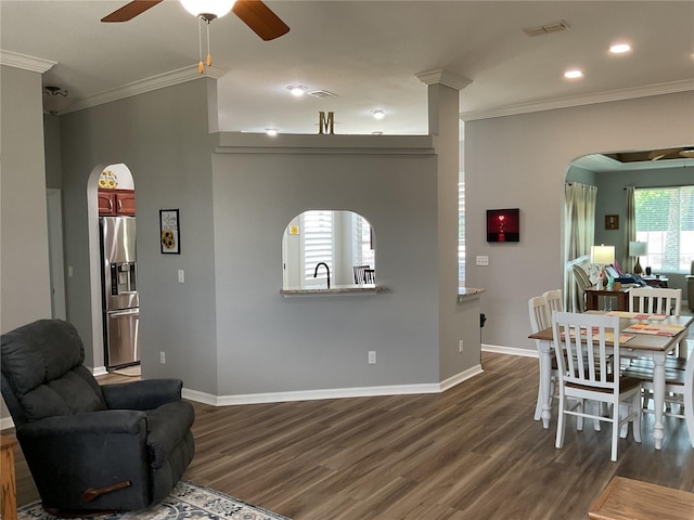 16863 SE 110th Court Rd, Summerfield, FL 34491 - living area featuring arched walkways, crown molding, a ceiling fan, dark wood-style flooring, and recessed lighting