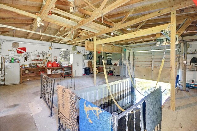 5319 Eagles Nest Rd, Fruitland Park, FL 34731 - garage with fridge