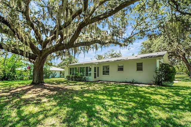 5319 Eagles Nest Rd, Fruitland Park, FL 34731 - back of property featuring a lawn