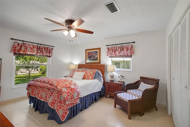 5319 Eagles Nest Rd, Fruitland Park, FL 34731 - bedroom featuring a closet, light tile patterned flooring, and a ceiling fan
