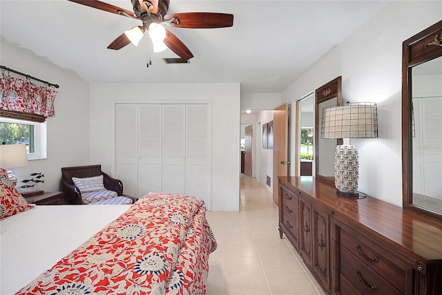 5319 Eagles Nest Rd, Fruitland Park, FL 34731 - bedroom featuring multiple windows, light tile patterned floors, a closet, and a ceiling fan