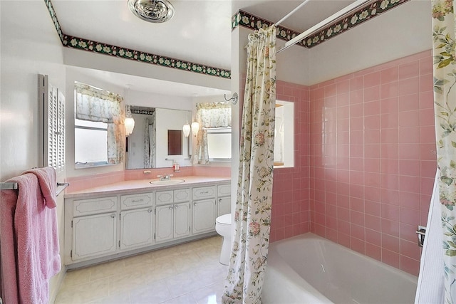 5319 Eagles Nest Rd, Fruitland Park, FL 34731 - bathroom featuring shower / bath combo with shower curtain, vanity, and tile patterned floors