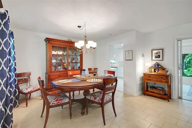 5319 Eagles Nest Rd, Fruitland Park, FL 34731 - dining area with a chandelier and light tile patterned floors