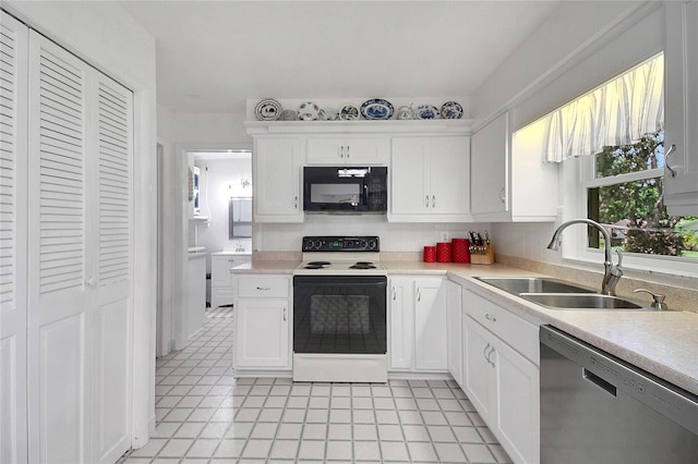 5319 Eagles Nest Rd, Fruitland Park, FL 34731 - kitchen featuring black microwave, electric stove, stainless steel dishwasher, light countertops, and white cabinetry