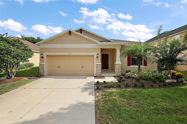 20945 Oldenburg Loop, Mount Dora, FL 32757 - craftsman-style house with stone siding, concrete driveway, an attached garage, and a front lawn