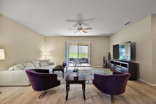 20945 Oldenburg Loop, Mount Dora, FL 32757 - living area featuring a ceiling fan and wood finished floors