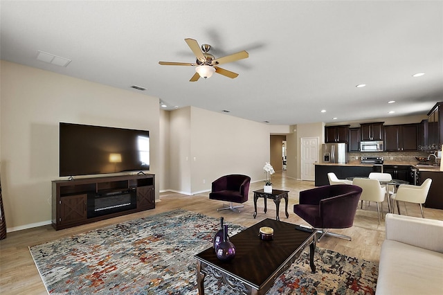 20945 Oldenburg Loop, Mount Dora, FL 32757 - living room with a ceiling fan, light wood-type flooring, and recessed lighting