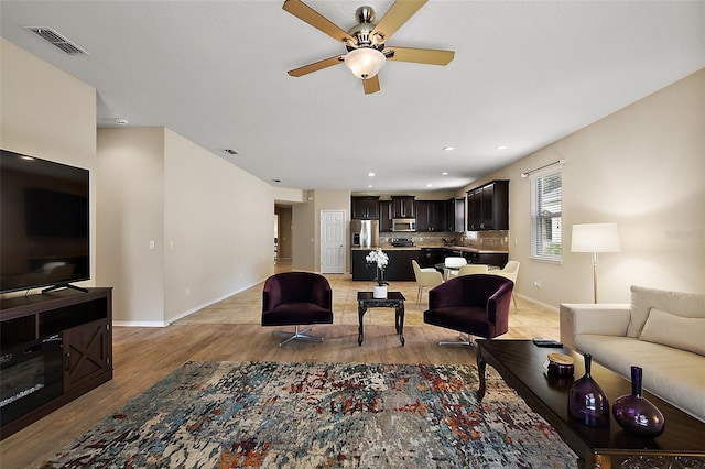 20945 Oldenburg Loop, Mount Dora, FL 32757 - living area featuring a ceiling fan, light wood-style floors, and recessed lighting
