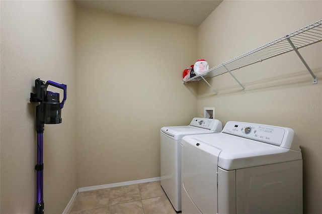 20945 Oldenburg Loop, Mount Dora, FL 32757 - laundry room featuring washing machine and dryer and baseboards