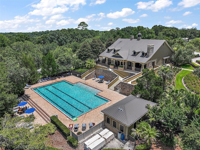 20945 Oldenburg Loop, Mount Dora, FL 32757 - view of subject property with a pool and a heavily wooded area