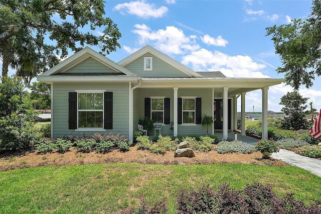 622 W 11th Ave, Mount Dora, FL 32757 - view of front of property with covered porch and a front yard