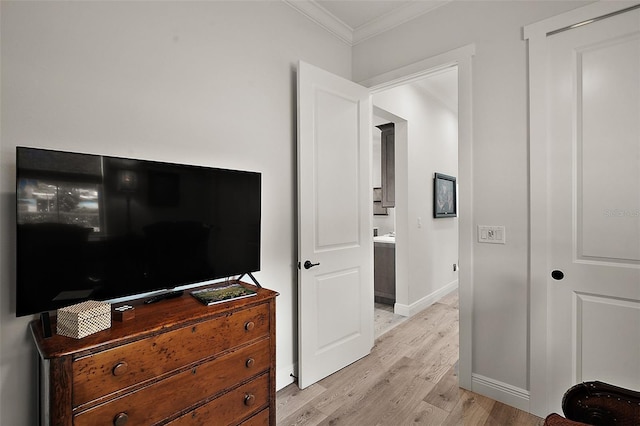 622 W 11th Ave, Mount Dora, FL 32757 - bedroom with crown molding and light wood-type flooring