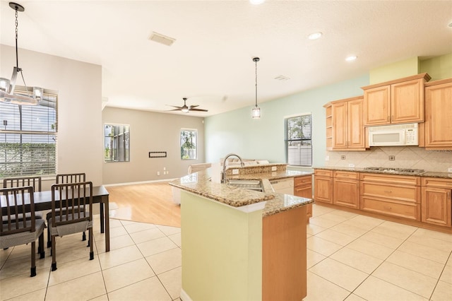 4548 Barrister Dr, Clermont, FL 34711 - kitchen featuring white appliances, light tile patterned floors, plenty of natural light, a ceiling fan, and recessed lighting