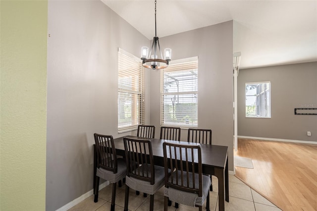 4548 Barrister Dr, Clermont, FL 34711 - dining area with a chandelier and light wood-style floors