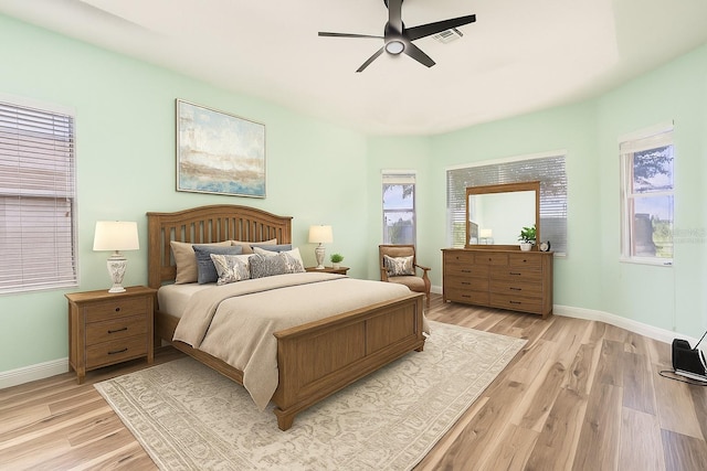 4548 Barrister Dr, Clermont, FL 34711 - bedroom with light wood-style flooring and ceiling fan