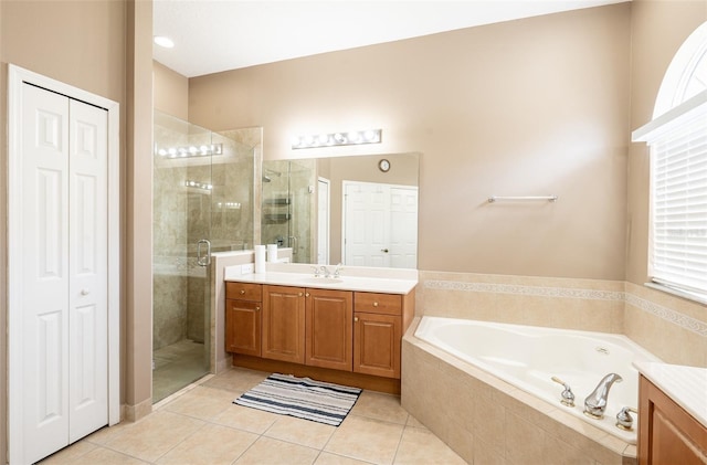 4548 Barrister Dr, Clermont, FL 34711 - full bathroom featuring a closet, vanity, a shower stall, and a garden tub