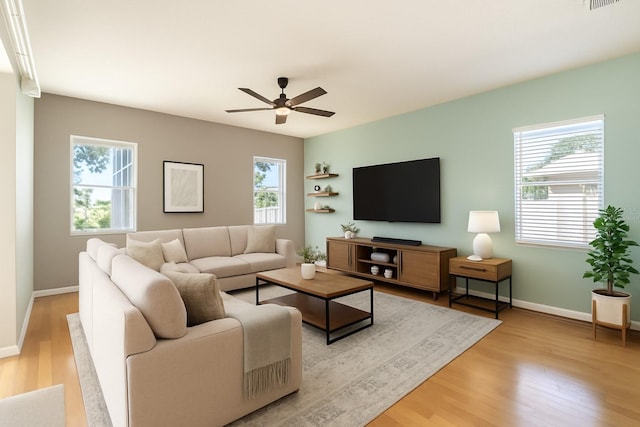 4548 Barrister Dr, Clermont, FL 34711 - living area with a ceiling fan and wood finished floors