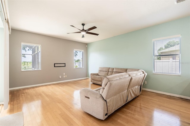 4548 Barrister Dr, Clermont, FL 34711 - living room with light wood-style flooring and a ceiling fan