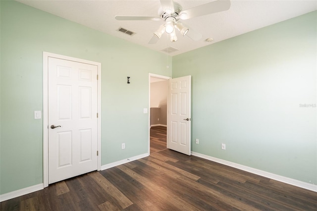 4548 Barrister Dr, Clermont, FL 34711 - unfurnished bedroom featuring dark wood finished floors and ceiling fan