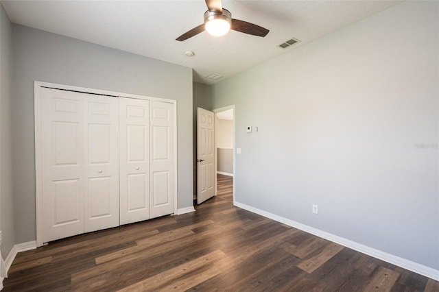 4548 Barrister Dr, Clermont, FL 34711 - unfurnished bedroom featuring dark wood finished floors, a closet, and ceiling fan