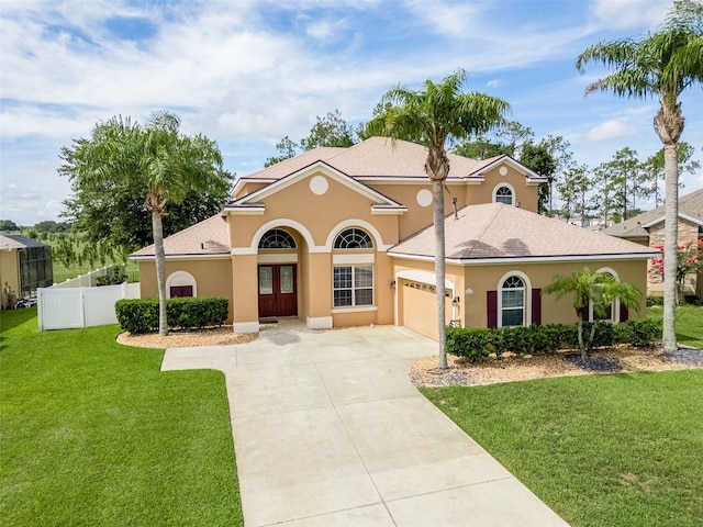 4548 Barrister Dr, Clermont, FL 34711 - mediterranean / spanish-style home featuring concrete driveway, a garage, stucco siding, and roof with shingles
