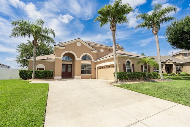 4548 Barrister Dr, Clermont, FL 34711 - mediterranean / spanish-style house featuring stucco siding, concrete driveway, and a garage