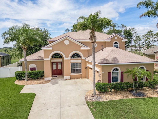 4548 Barrister Dr, Clermont, FL 34711 - mediterranean / spanish-style house with concrete driveway, a garage, stucco siding, and a shingled roof
