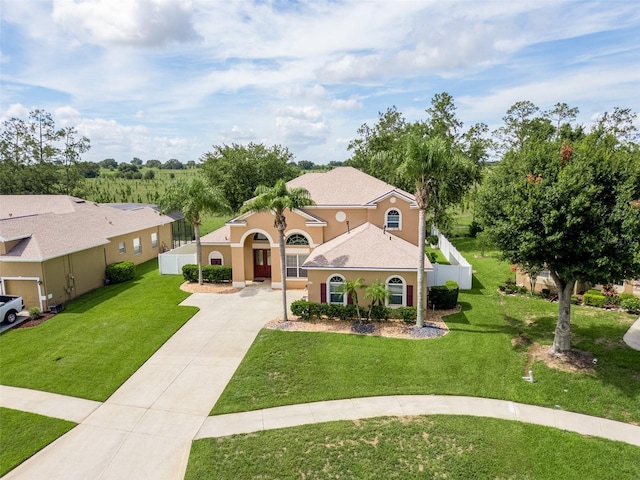 4548 Barrister Dr, Clermont, FL 34711 - mediterranean / spanish home with driveway and stucco siding