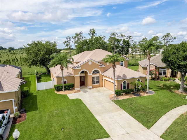 4548 Barrister Dr, Clermont, FL 34711 - mediterranean / spanish home with driveway, stucco siding, and an attached garage