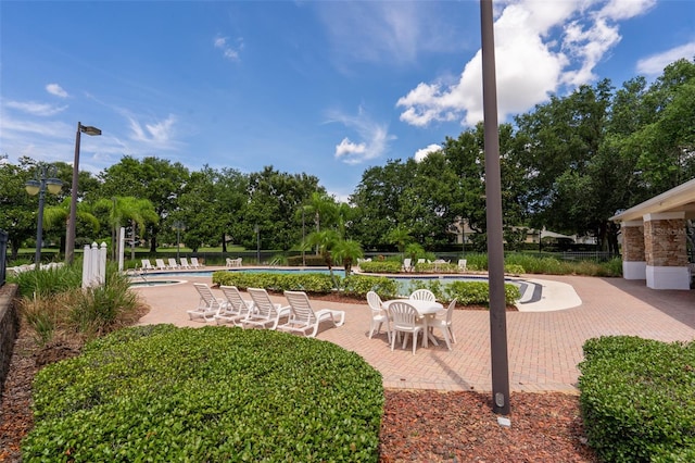 4548 Barrister Dr, Clermont, FL 34711 - view of yard with a patio and a community pool
