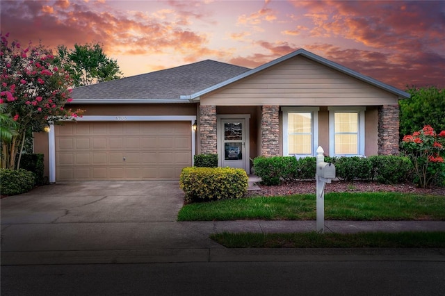 6906 Glenbrook Dr, Lakeland, FL 33811 - ranch-style house with driveway, a garage, stone siding, and roof with shingles
