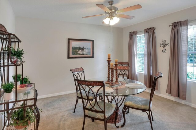6906 Glenbrook Dr, Lakeland, FL 33811 - dining area with light carpet, a ceiling fan, and plenty of natural light