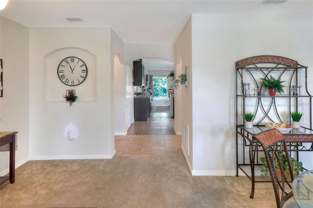 6906 Glenbrook Dr, Lakeland, FL 33811 - hallway featuring carpet flooring and arched walkways