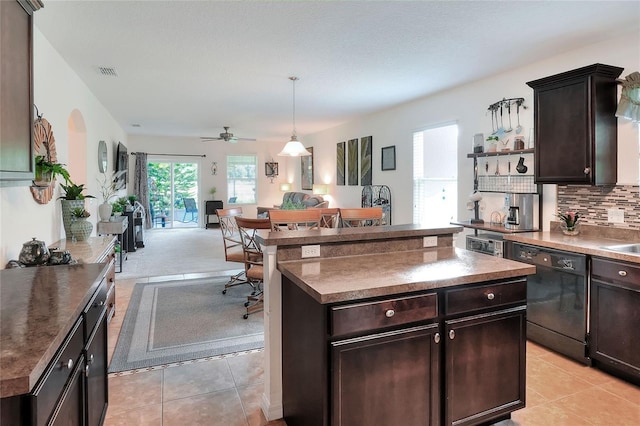 6906 Glenbrook Dr, Lakeland, FL 33811 - kitchen with dishwasher, open floor plan, light tile patterned floors, and dark brown cabinetry