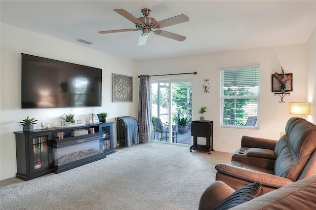 6906 Glenbrook Dr, Lakeland, FL 33811 - carpeted living room with ceiling fan and baseboards