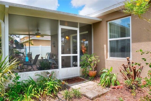 6906 Glenbrook Dr, Lakeland, FL 33811 - view of exterior entry with ceiling fan and stucco siding