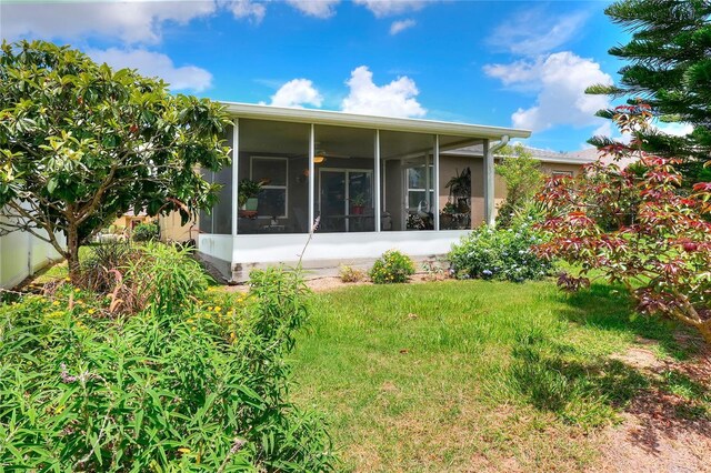 6906 Glenbrook Dr, Lakeland, FL 33811 - rear view of property featuring a sunroom and a yard